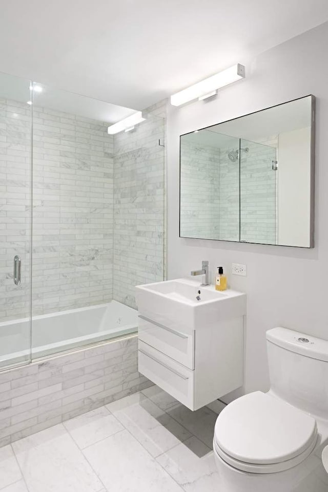 16 E 80th St Unit 4B5Bc, New York City, NY 10075 - bathroom featuring tiled shower / bath combo, toilet, and vanity