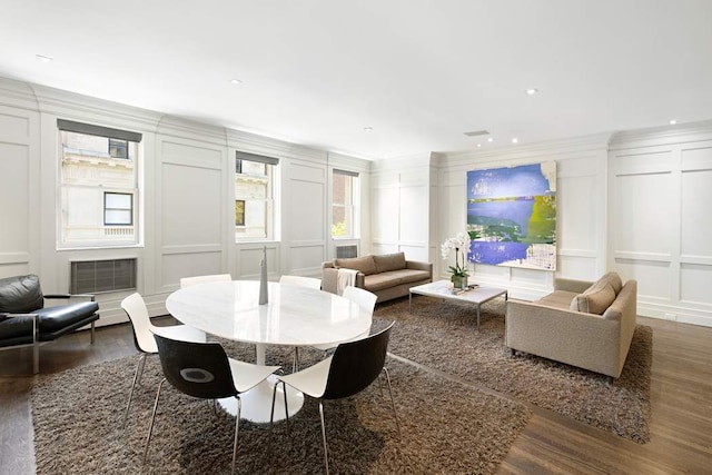 16 E 80th St Unit 4B5Bc, New York City, NY 10075 - dining room featuring a decorative wall, wood finished floors, and ornamental molding