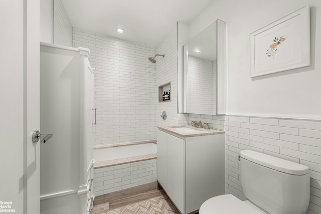 350 W 71st St Unit 2F, New York City, NY 10023 - full bath with tiled shower / bath combo, toilet, tile walls, and vanity