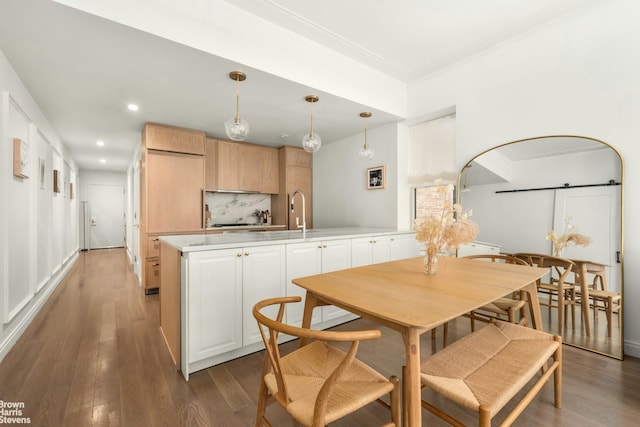 350 W 71st St Unit 2F, New York City, NY 10023 - dining room with recessed lighting, arched walkways, crown molding, and wood finished floors