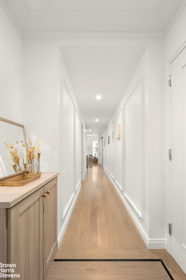 350 W 71st St Unit 2F, New York City, NY 10023 - corridor with crown molding, recessed lighting, baseboards, and light wood-type flooring