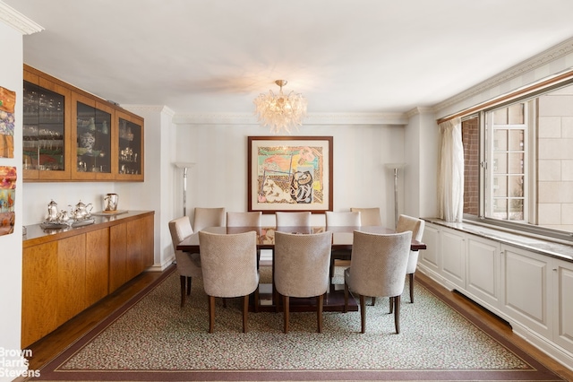 40 E 80th St Unit 3A, New York City, NY 10021 - dining space with dark wood-style flooring, a chandelier, and ornamental molding