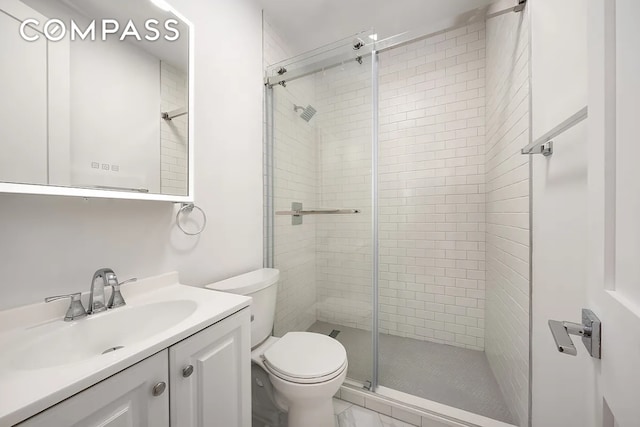 130 W 80th St Unit 5R, New York City, NY 10024 - bathroom featuring a stall shower, toilet, vanity, and marble look tiles