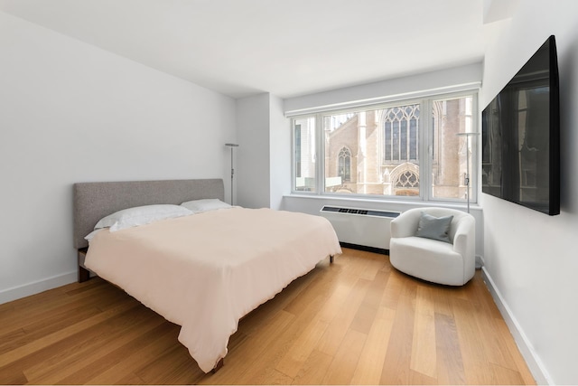 408 E 79th St Unit 3B, New York City, NY 10075 - bedroom featuring light wood-style flooring, baseboards, and radiator