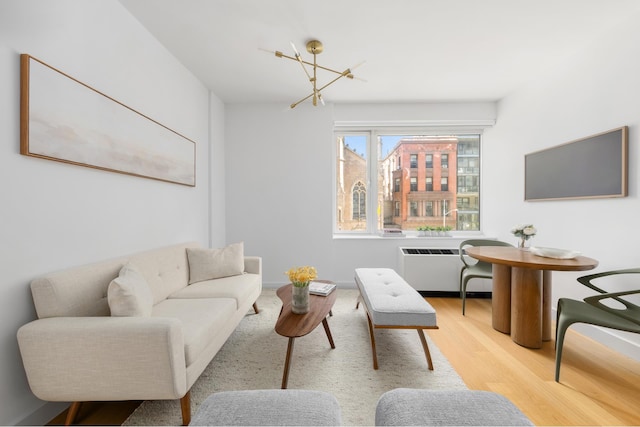 408 E 79th St Unit 3B, New York City, NY 10075 - living room featuring a chandelier, wood finished floors, and radiator