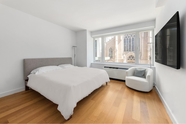 408 E 79th St Unit 3B, New York City, NY 10075 - bedroom with light wood-style floors, baseboards, and radiator