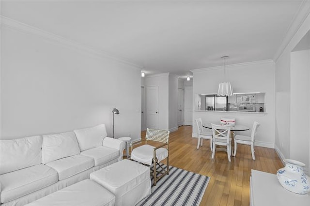 200 Riverside Blvd Unit 30-B, New York City, NY 10069 - living room with ornamental molding, light wood-style flooring, and baseboards