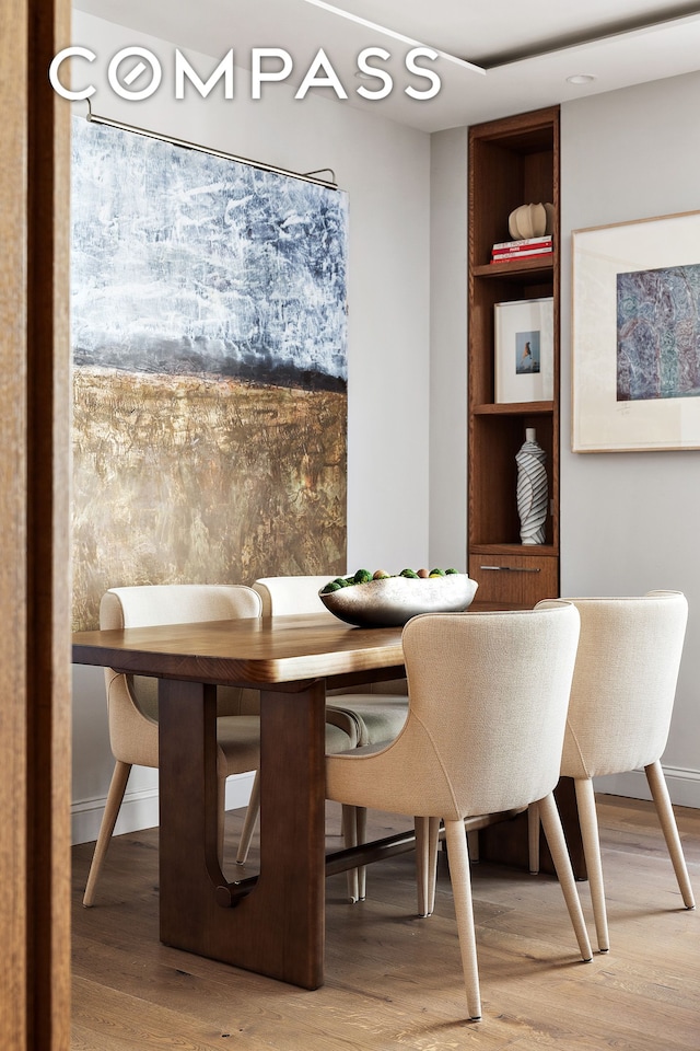 dining space with light wood finished floors