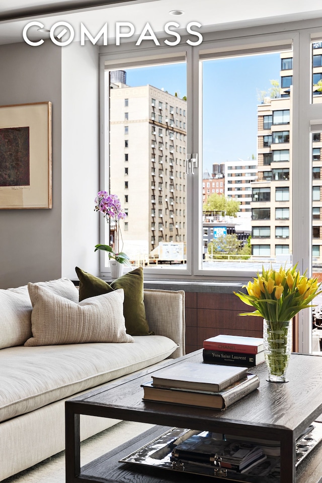 sitting room featuring a view of city