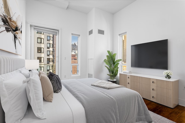 250 E 49th St Unit 10A, New York City, NY 10017 - bedroom with dark wood-style floors