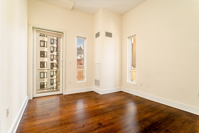 250 E 49th St Unit 10A, New York City, NY 10017 - empty room featuring dark wood-style flooring and baseboards