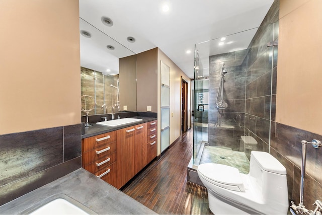 15 W 53rd St Unit 30F, New York City, NY 10019 - full bathroom with toilet, hardwood / wood-style floors, a stall shower, vanity, and recessed lighting