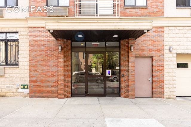 416 E 117th St Unit 5A, New York City, NY 10035 - doorway to property featuring brick siding and french doors