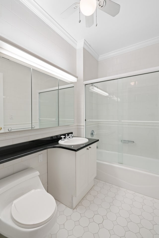 full bathroom with crown molding, vanity, toilet, tile patterned floors, and a ceiling fan