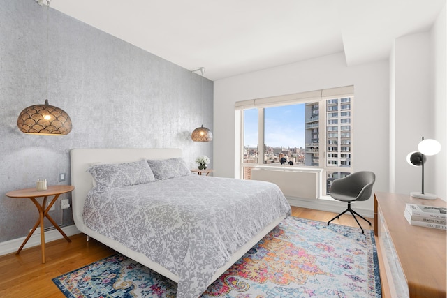 bedroom featuring wood finished floors
