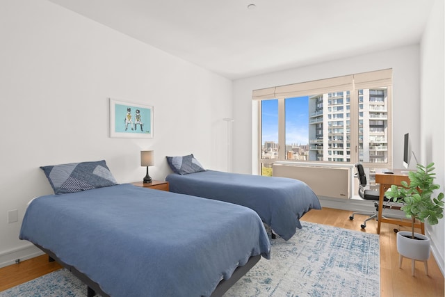 bedroom with wood finished floors