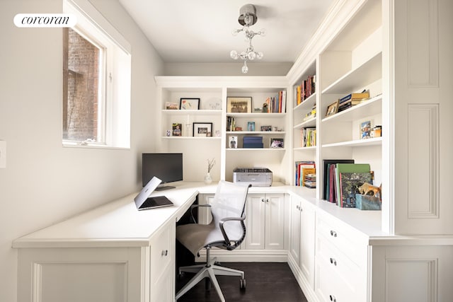 home office with dark wood-style floors, built in features, and built in study area