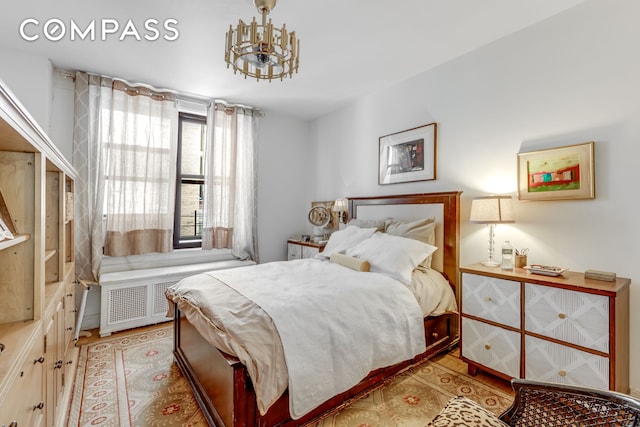 bedroom with a chandelier