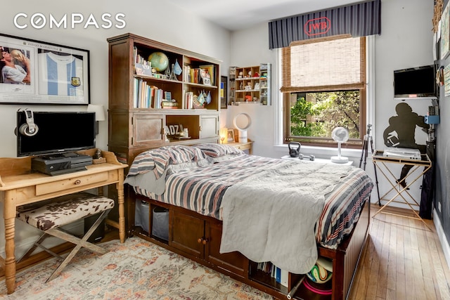 bedroom featuring light wood-style flooring