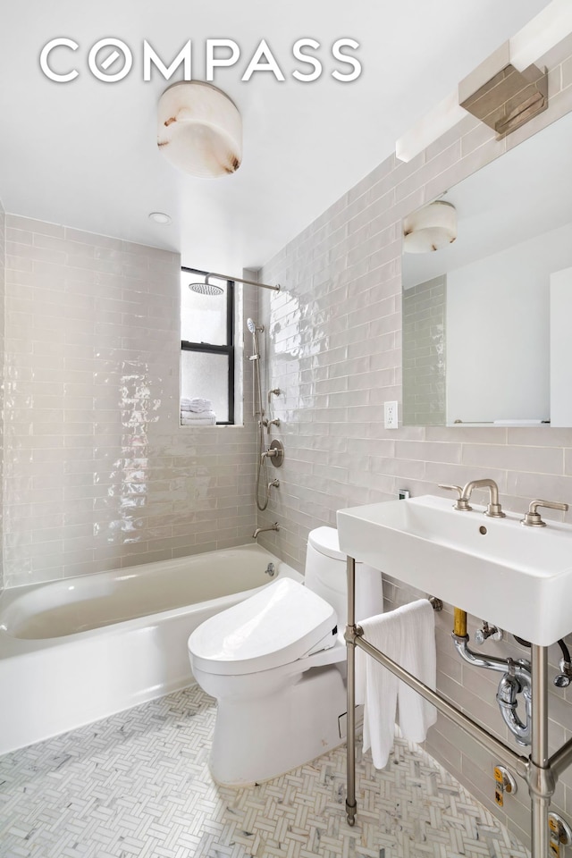 full bathroom with shower / bathtub combination, toilet, tile walls, and tasteful backsplash