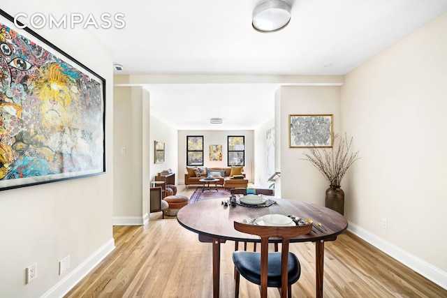 303 E 37th St Unit 2K, New York City, NY 10016 - dining space with light wood finished floors and baseboards