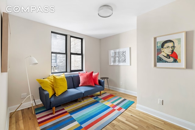 living room featuring light wood-style floors and baseboards