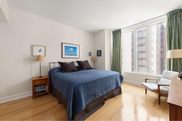 245 W 99th St Unit 7B, New York City, NY 10025 - bedroom with light wood-type flooring and baseboards