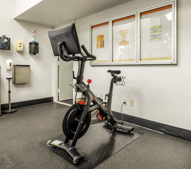 exercise room with baseboards