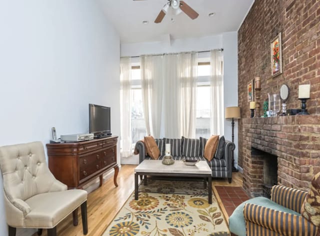304 W 88th St Unit 1D, New York City, NY 10024 - living room featuring ceiling fan, wood finished floors, and a fireplace