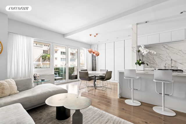 living room featuring wood finished floors and visible vents