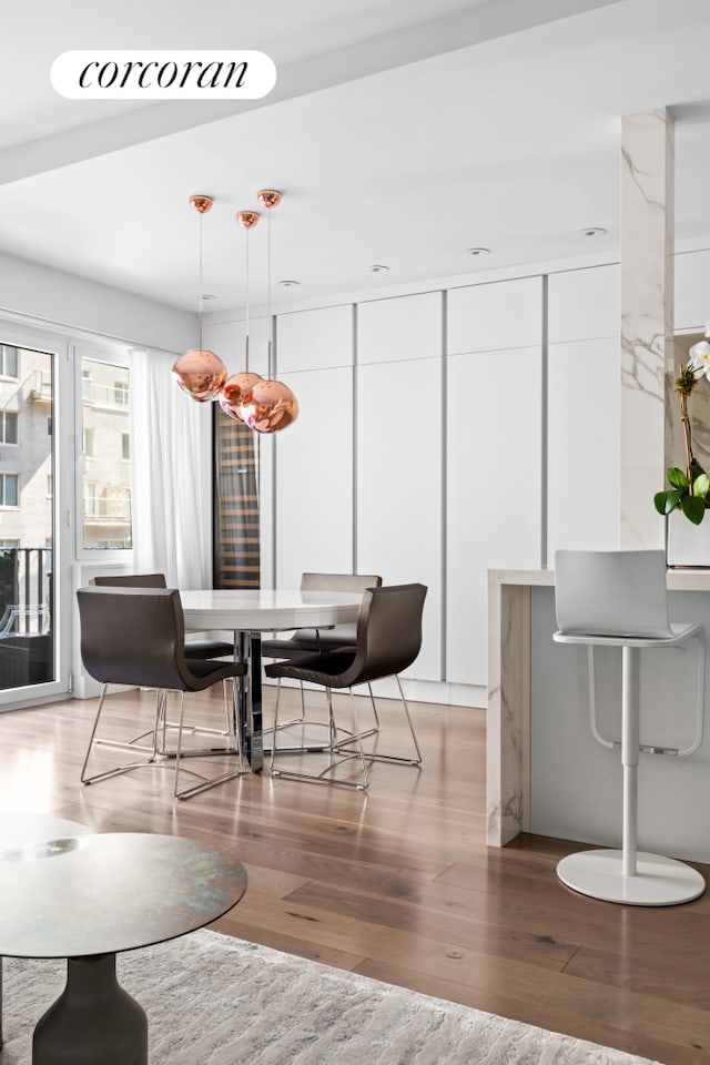 dining room with light wood-style flooring