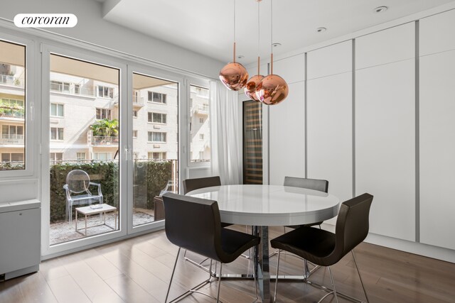 dining space featuring light wood-style floors