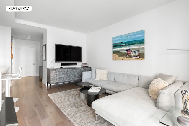 living room with visible vents and hardwood / wood-style flooring