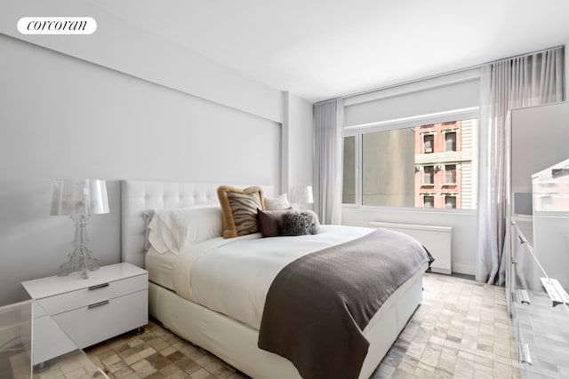 bedroom featuring radiator heating unit