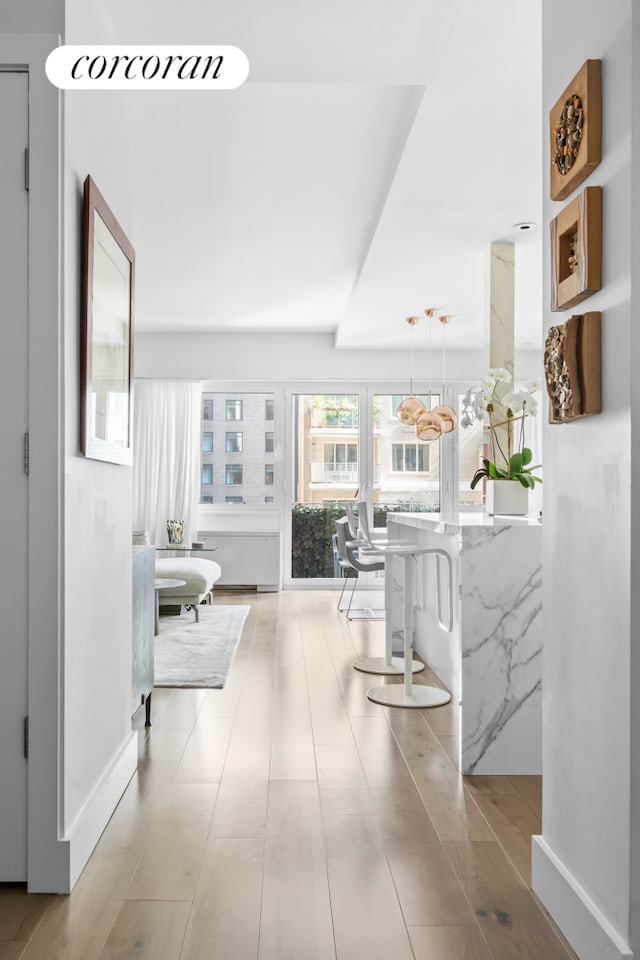 corridor featuring baseboards