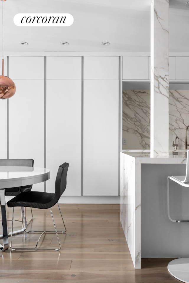 dining area featuring light wood-style flooring