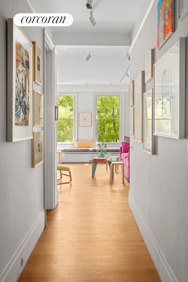 61 Pierrepont St Unit 51/52, New York City, NY 11201 - corridor with track lighting, wood finished floors, and baseboards