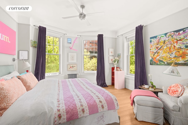 61 Pierrepont St Unit 51/52, New York City, NY 11201 - bedroom featuring radiator, light wood-style floors, multiple windows, and ceiling fan