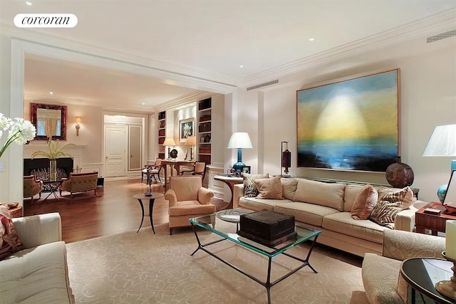 830 Park Ave Unit 1A, New York City, NY 10021 - living room featuring wood finished floors, crown molding, built in features, a fireplace, and recessed lighting