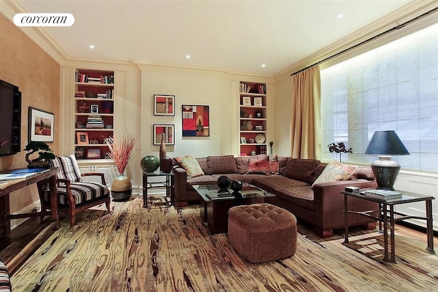 living area featuring crown molding, built in features, baseboards, wood finished floors, and visible vents