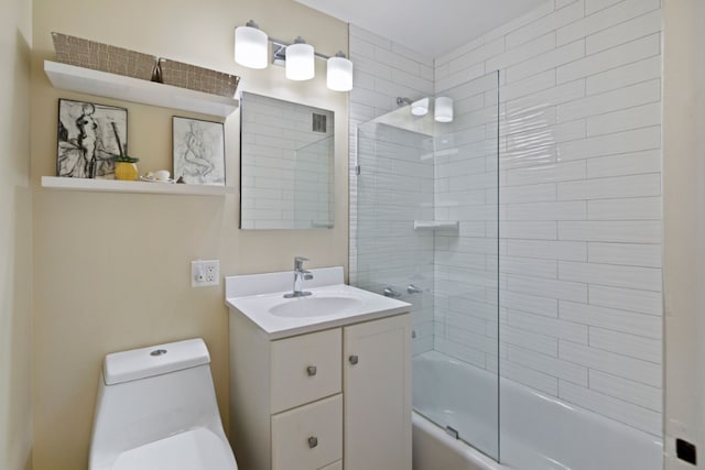 bathroom with vanity, bathtub / shower combination, and toilet