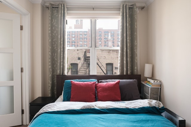 bedroom with crown molding