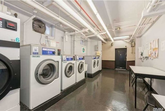 community laundry room featuring washing machine and dryer
