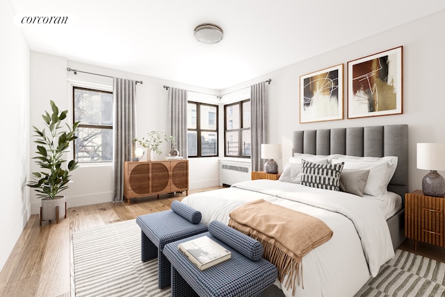 3000 Valentine Ave Unit 5J, New York City, NY 10458 - bedroom with light wood-style flooring, baseboards, and radiator heating unit