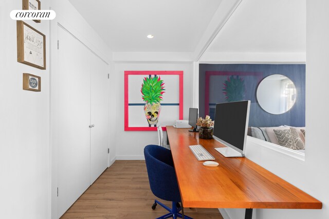 office space with wood finished floors, recessed lighting, and baseboards