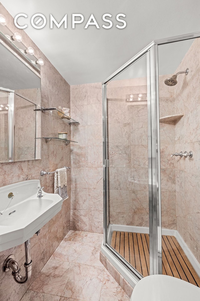 bathroom featuring a shower stall