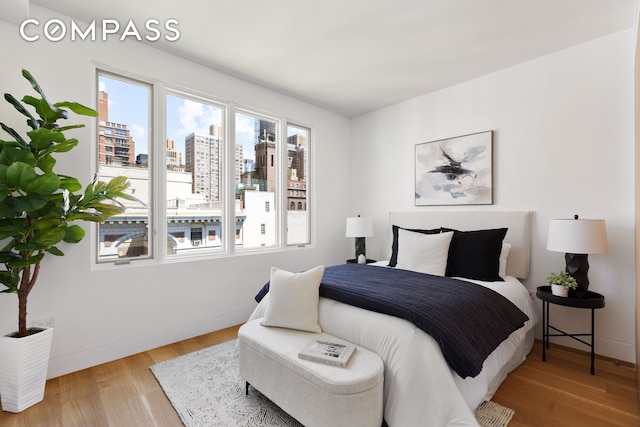 120 E 29th St Phb, Phb, New York City, NY 10016 - bedroom with wood finished floors and a view of city