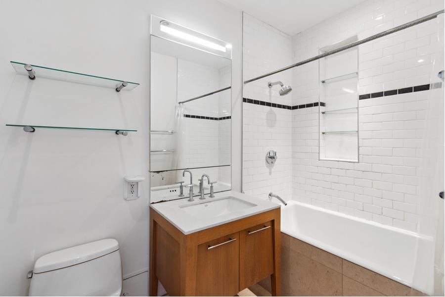 85 Adams St Unit 10B, New York City, NY 11201 - full bathroom with vanity and tiled shower / bath combo