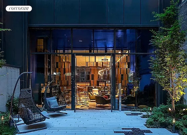 view of exterior entry featuring a deck