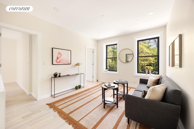 sitting room with light wood finished floors and baseboards